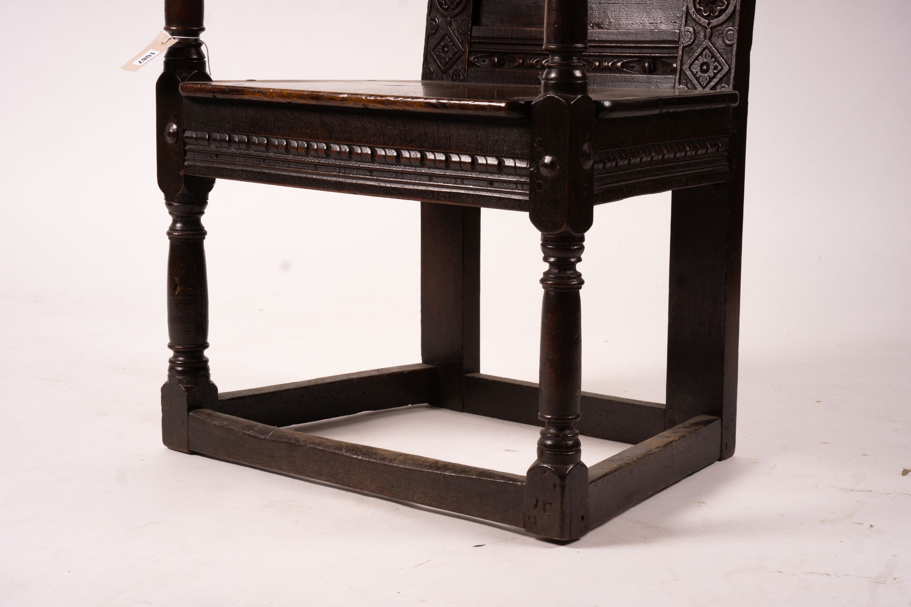 A 17th century Yorkshire area carved oak wainscot chair, width 62cm, depth 48cm, height 118cm